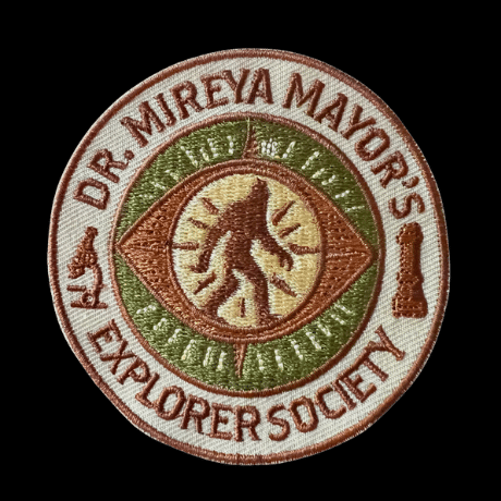 Custom Embroidered Explorer Society Patch 1 High-quality close-up of the Explorer Society embroidered patch by Dr. Mireya Mayor. Perfect for explorers and wildlife enthusiasts, this adventure patch is a unique piece of official exploration gear.